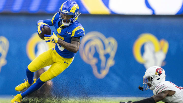 October 15, 2023; Inglewood, California, USA; Los Angeles Rams wide receiver Tutu Atwell (5) runs the football against Arizona Cardinals cornerback Kei'Trel Clark (13) during the third quarter at SoFi Stadium. Mandatory Credit: Kyle Terada-Imagn Images October 15, 2023; Inglewood, California, USA; Los Angeles Rams wide receiver Tutu Atwell (5) runs the football against Arizona Cardinals cornerback Kei'Trel Clark (13) during the third quarter at SoFi Stadium. Mandatory Credit: Kyle Terada-Imagn Images