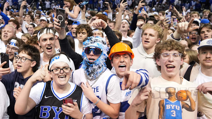 Mar 7, 2026; Provo, Utah, USA; BYU Cougars fans storm the court after a win over the Texas Tech Red Raiders at Marriott Center. Mandatory Credit: Aaron Baker-Imagn Images 