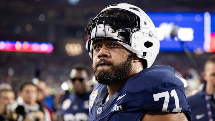 Dec 31, 2024; Glendale, AZ, USA; Penn State Nittany Lions offensive lineman Olaivavega Ioane (71) against the Boise State Broncos during the Fiesta Bowl at State Farm Stadium. Mandatory Credit: Mark J. Rebilas-Imagn Images