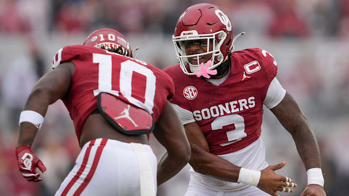 Oklahoma safety Robert Spears-Jennings celebrates with linebacker Kip Lewis.