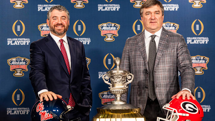 Ole Miss head coach Pete Golding and Georgia head coach Kirby Smart pose for pictures during a press conference for the Sugar Bowl and College Football Playoff quarterfinals at the Sheraton New Orleans Hotel in New Orleans, La., on Wednesday, Dec. 31, 2025.
