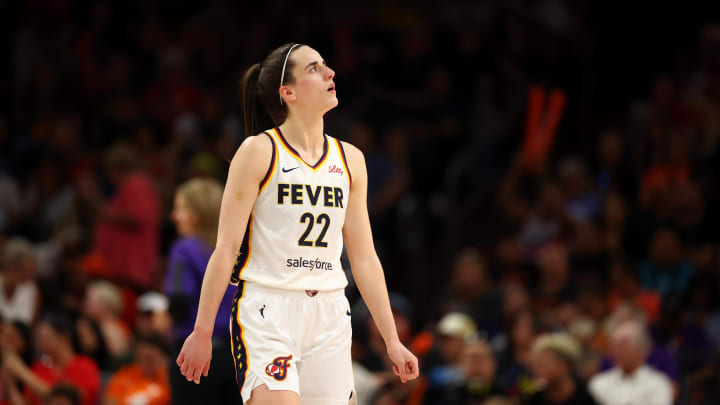 Indiana Fever rookie point guard Caitlin Clark looks up while on the court. 