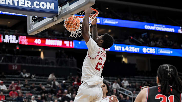 Dec 20, 2025; Newark, New Jersey, USA; Arkansas Razorbacks forward Billy Richmond III (24) dunks the ball against the Houston Cougars during the first half at Prudential Center. Mandatory Credit: John Jones-Imagn Images