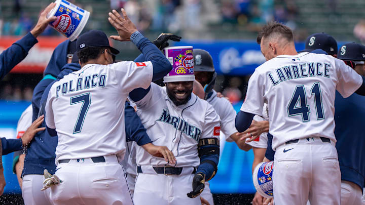 Seattle Mariners left fielder Randy Arozarena (center) celebrates after a win against the Houston Astros on April 9 at T-Mobile Park.