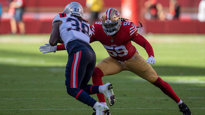 Sep 29, 2024; Santa Clara, California, USA; San Francisco 49ers linebacker De'Vondre Campbell (59) tackles New England Patriots running back Rhamondre Stevenson (38) during the fourth quarter at Levi's Stadium. Mandatory Credit: Neville E. Guard-Imagn Images
