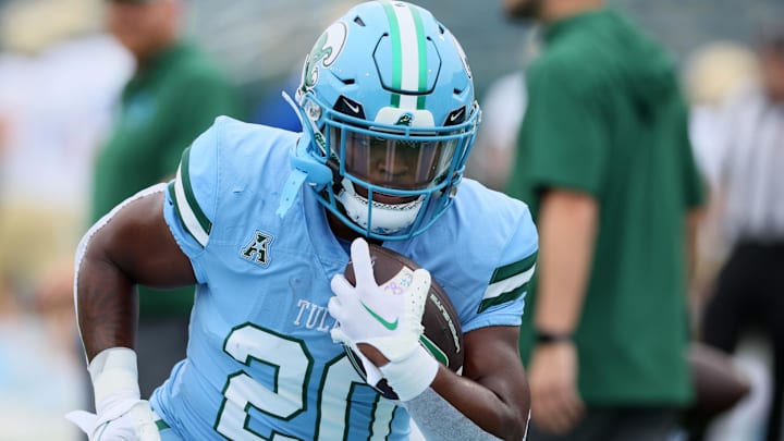 Nov 11, 2023; New Orleans, Louisiana, USA; Tulane Green Wave running back Arnold Barnes III (20) warms up before their game against the Tulsa Golden Hurricanes at Yulman Stadium. Nov 11, 2023; New Orleans, Louisiana, USA; Tulane Green Wave running back Arnold Barnes III (20) warms up before their game against the Tulsa Golden Hurricanes at Yulman Stadium.