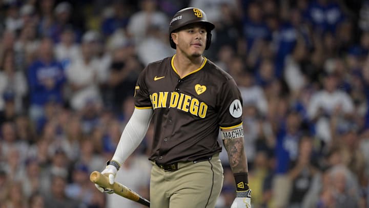 Oct 6, 2024; Los Angeles, California, USA; San Diego Padres third baseman Manny Machado (13) reacts after striking out in the sixth inning against the Los Angeles Dodgers during game two of the NLDS for the 2024 MLB Playoffs at Dodger Stadium. Mandatory Credit: Jayne Kamin-Oncea-Imagn Images Oct 6, 2024; Los Angeles, California, USA; San Diego Padres third baseman Manny Machado (13) reacts after striking out in the sixth inning against the Los Angeles Dodgers during game two of the NLDS for the 2024 MLB Playoffs at Dodger Stadium. Mandatory Credit: Jayne Kamin-Oncea-Imagn Images