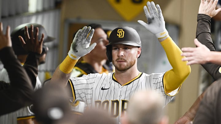 Aug 20, 2025; San Diego, California, USA; San Diego Padres first baseman Ryan O'Hearn (32) is congratulated after hitting a solo home run during the seventh inning against the San Francisco Giants at Petco Park. Mandatory Credit: Denis Poroy-Imagn Images