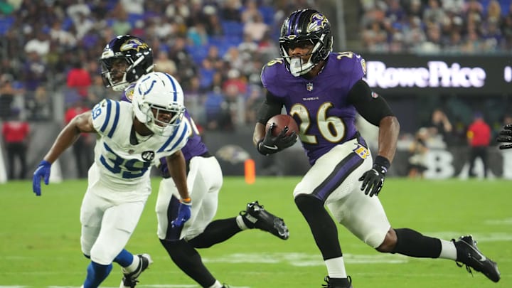 Aug 7, 2025; Baltimore, Maryland, USA; Baltimore Ravens running back Rasheen Ali (26) runs for a second quarter gain defended by Indianapolis Colts cornerback Alex Johnson (39) at M&T Bank Stadium. Mandatory Credit: Mitch Stringer-Imagn Images Aug 7, 2025; Baltimore, Maryland, USA; Baltimore Ravens running back Rasheen Ali (26) runs for a second quarter gain defended by Indianapolis Colts cornerback Alex Johnson (39) at M&T Bank Stadium. Mandatory Credit: Mitch Stringer-Imagn Images