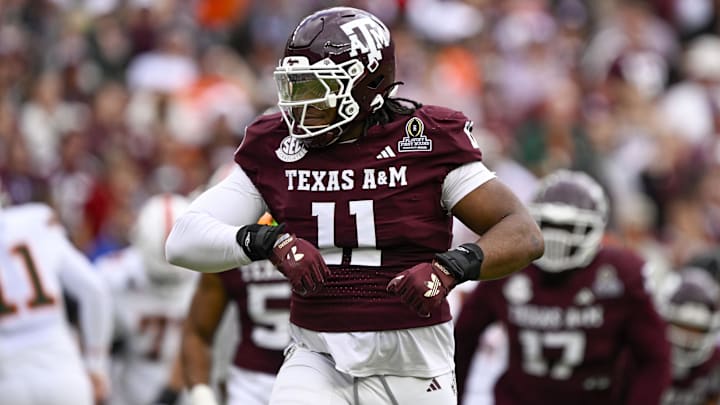 Dec 20, 2025; College Station, TX, USA; Texas A&M Aggies defensive tackle Tyler Onyedim (11) celebrates during the game between the Aggies and the Hurricanes at Kyle Field. 