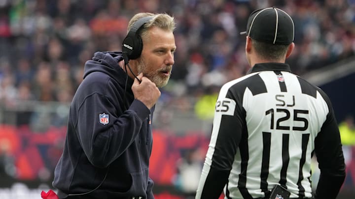 Oct 13, 2024; London, United Kingdom; Chicago Bears coach Matt Eberflus talks with side judge Chad Hill (125) against the Jacksonville Jaguars in the second half during an NFL International Series game at Tottenham Hotspur Stadium. Mandatory Credit: Kirby Lee-Imagn Images
