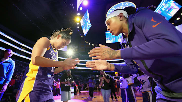 Jun 9, 2025; Los Angeles, California, USA; LA Sparks guard Kelsey Plum (10) is greeted by forward Emma Cannon (32) before the game against the Golden State Valkyries at Crypto.com Arena. Mandatory Credit: Kirby Lee-Imagn Images