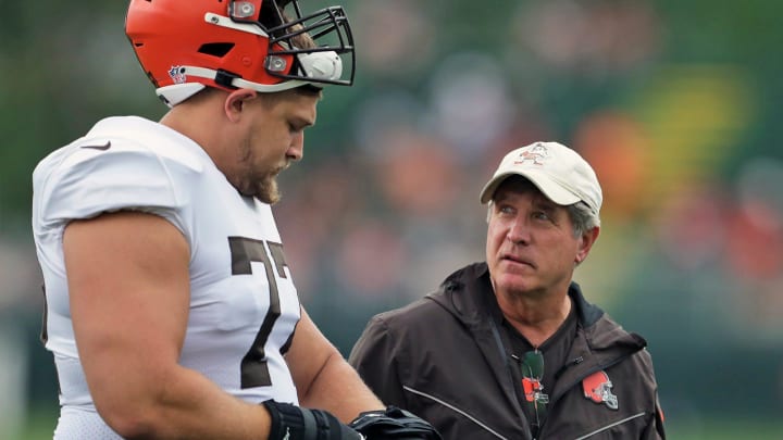 Browns offensive guard Wyatt Teller speaks with offensive line coach Bill Callahan during practice, Tuesday, Aug. 10, 2021, in Berea.