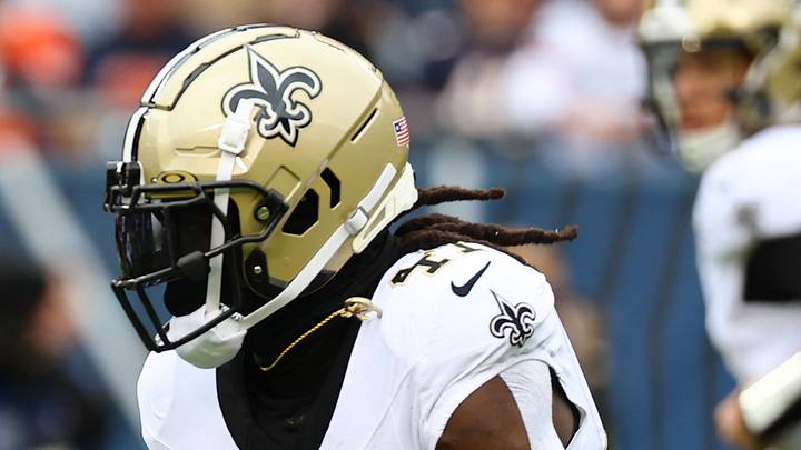 Oct 19, 2025; Chicago, Illinois, USA; New Orleans Saints running back Alvin Kamara (41) rushes the ball against the Chicago Bears during the first quarter at Soldier Field. 