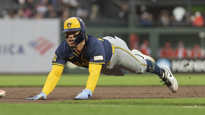 Sep 10, 2024; San Francisco, California, USA;  Milwaukee Brewers catcher William Contreras (24) dives towards third base during the first inning against the San Francisco Giants at Oracle Park. Mandatory Credit: Stan Szeto-Imagn Images