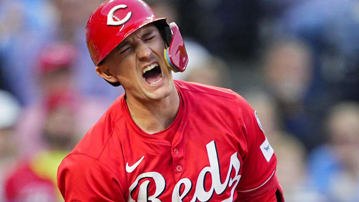 May 28, 2025; Kansas City, Missouri, USA; Cincinnati Reds designated hitter Austin Hays (12) reacts after fouling a ball off of his leg during the sixth inning against the Kansas City Royals at Kauffman Stadium. Mandatory Credit: Jay Biggerstaff-Imagn Images
