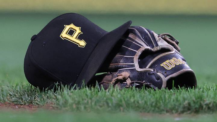 Sep 16, 2025; Pittsburgh, Pennsylvania, USA; A hat and glove belonging to Pittsburgh Pirates third baseman Jared Triolo (not pictured) on the field against the Chicago Cubs during the sixth inning at PNC Park. Mandatory Credit: Charles LeClaire-Imagn Images Sep 16, 2025; Pittsburgh, Pennsylvania, USA; A hat and glove belonging to Pittsburgh Pirates third baseman Jared Triolo (not pictured) on the field against the Chicago Cubs during the sixth inning at PNC Park. Mandatory Credit: Charles LeClaire-Imagn Images