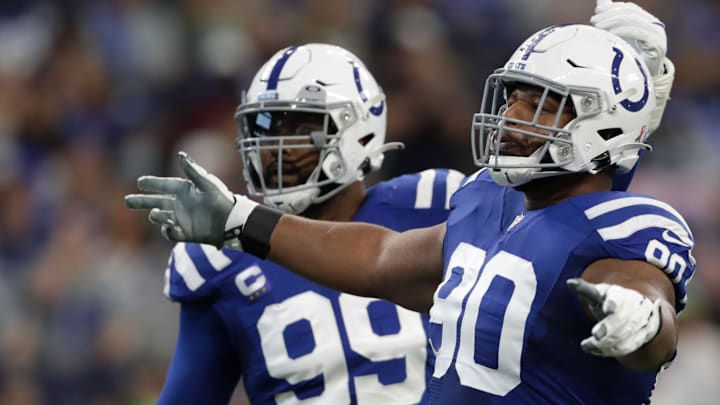Indianapolis Colts defensive tackle Grover Stewart (90) and Indianapolis Colts defensive tackle DeForest Buckner (99) react after a play Sunday, Sept. 12, 2021, during the regular season opener against the Seattle Seahawks at Lucas Oil Stadium in Indianapolis.