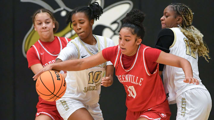 Greenville guard Ava Owens (10) grabs a loose ball.