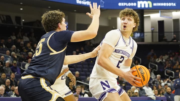 Montana State Bobcats forward Sam Lecholat (25) defends Northwestern Wildcats forward Nick Martinelli (2) during the second half at Welsh-Ryan Arena.