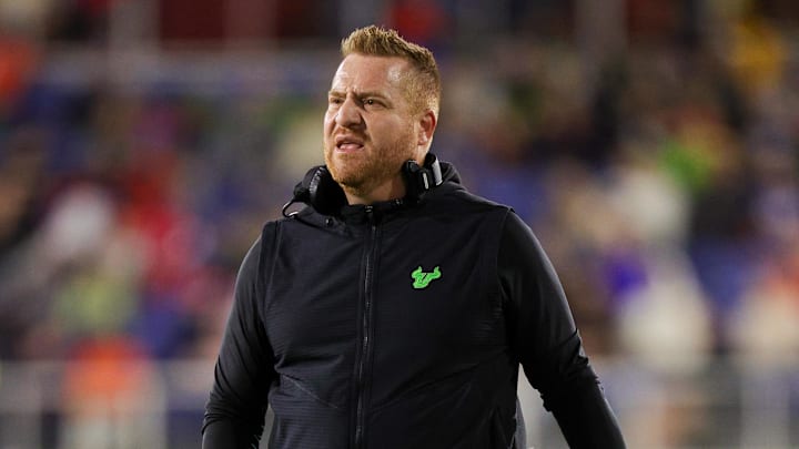 Dec 21, 2023; Boca Raton, FL, USA;  South Florida Bulls head coach Alex Golesh reacts to a play call against the Syracuse Orange in the second quarter during the RoofClaim.com Boca Raton Bowl at FAU Stadium. Mandatory Credit: Nathan Ray Seebeck-Imagn Images