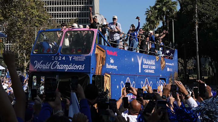 Nov 1, 2024; Los Angeles, CA, USA; General view as Los Angeles Dodgers manager Dave Roberts (30) celebrates with the Commissioner’s Trophy during the 2024 World Series championship parade near Los Angeles City Hall. Nov 1, 2024; Los Angeles, CA, USA; General view as Los Angeles Dodgers manager Dave Roberts (30) celebrates with the Commissioner’s Trophy during the 2024 World Series championship parade near Los Angeles City Hall.
