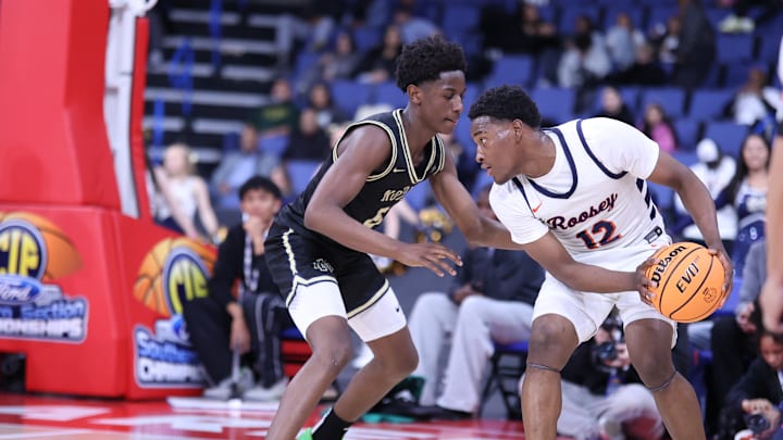 Roosevelt's Issac Williamson (with the ball) sizes up a Notre Dame defender in the CIF Southern Section Open Division final.