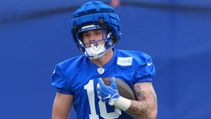 May 28, 2025; Woodland Hills, CA, USA; Los Angeles Rams tight end Terrance Ferguson (18) runs with the ball during organized team activities at Rams Practice Facility. Mandatory Credit: Kirby Lee-Imagn Images