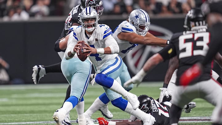 Nov 3, 2024; Atlanta, Georgia, USA; Dallas Cowboys quarterback Dak Prescott (4) runs out of the pocket against the Atlanta Falcons during the second half at Mercedes-Benz Stadium. Mandatory Credit: Dale Zanine-Imagn Images