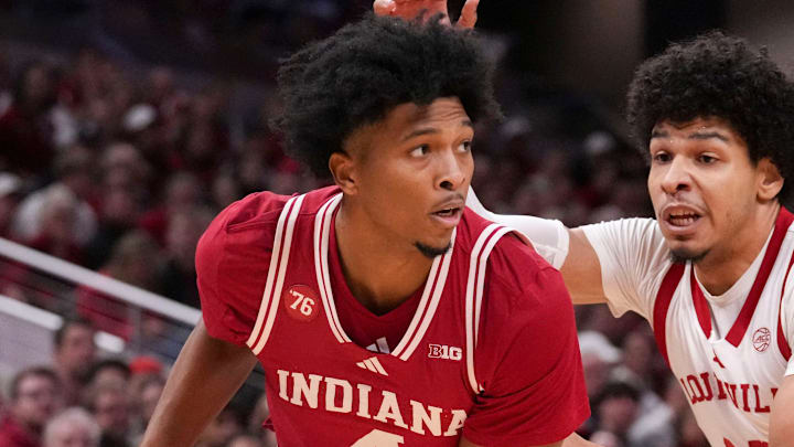 Louisville Cardinals forward Sananda Fru (13) defends Indiana Hoosiers forward Sam Alexis (4) at Gainbridge Fieldhouse in Indianapolis. Louisville Cardinals forward Sananda Fru (13) defends Indiana Hoosiers forward Sam Alexis (4) at Gainbridge Fieldhouse in Indianapolis.