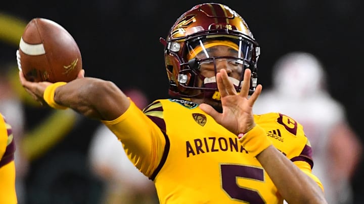 Dec 30, 2021; Paradise, Nevada, USA; Arizona State Sun Devils quarterback Jayden Daniels (5) warms up before facing the Wisconsin Badgers in the 2021 Las Vegas Bowl at Allegiant Stadium. Mandatory Credit: Stephen R. Sylvanie-Imagn Images