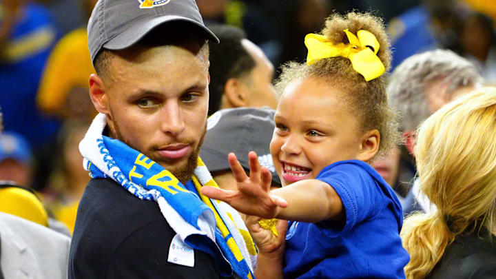 Golden State Warriors guard Stephen Curry (30) celebrates with his daughter Riley Curry after beating the Cleveland Cavaliers in game five of the 2017 NBA Finals at Oracle Arena. Golden State Warriors guard Stephen Curry (30) celebrates with his daughter Riley Curry after beating the Cleveland Cavaliers in game five of the 2017 NBA Finals at Oracle Arena.