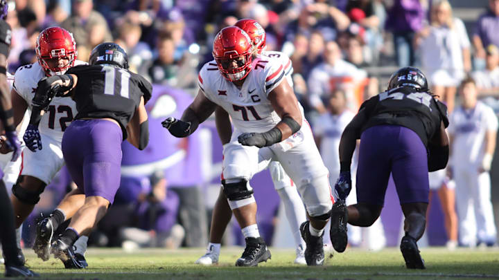 Arizona Wildcats offensive lineman Jonah Savaiinaea (71) blocks in the second quarter against the TCU Horned Frogs at Amon G. Carter Stadium. Arizona Wildcats offensive lineman Jonah Savaiinaea (71) blocks in the second quarter against the TCU Horned Frogs at Amon G. Carter Stadium.