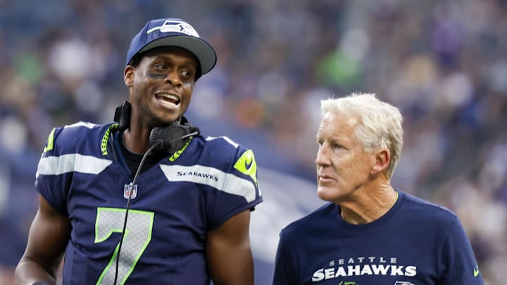 Aug 19, 2023; Seattle, Washington, USA; Seattle Seahawks quarterback Geno Smith (7) talks with head coach Pete Carroll during the second quarter against the Dallas Cowboys at Lumen Field. Mandatory Credit: Joe Nicholson-Imagn Images