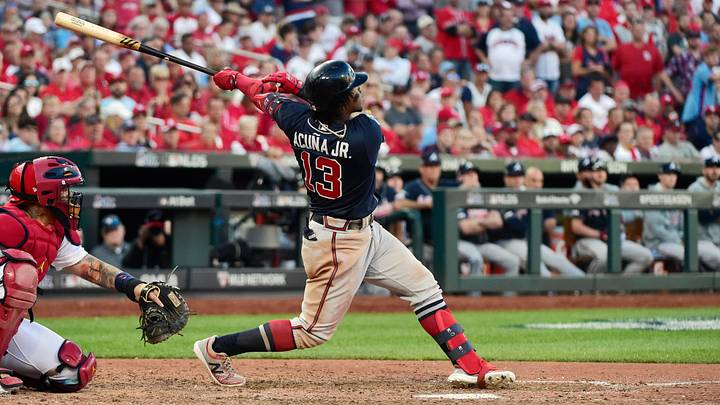 Oct 7, 2019; St. Louis, MO, USA; Atlanta Braves center fielder Ronald Acuna Jr. (13) hits a ground rule double in the ninth inning against the St. Louis Cardinals in game four of the 2019 NLDS playoff baseball series at Busch Stadium. Mandatory Credit: Jeff Curry-USA TODAY Sports