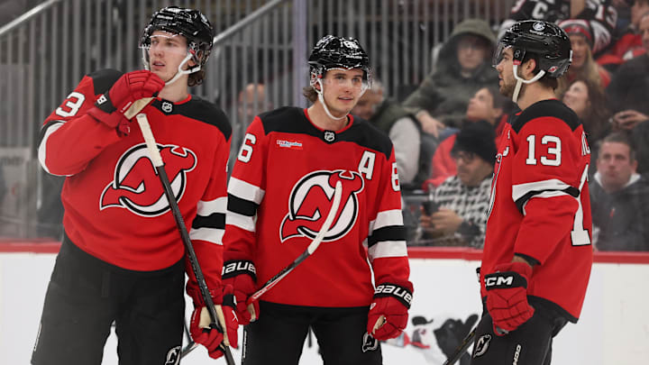 Jan 3, 2026; Newark, New Jersey, USA; New Jersey Devils defenseman Luke Hughes (43),  center Jack Hughes (86) and center Nico Hischier (13) talk during the second period of their game against the Utah Mammoth at Prudential Center. Mandatory Credit: Ed Mulholland-Imagn Images