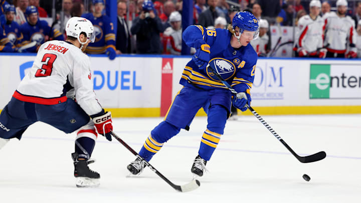Apr 11, 2024; Buffalo, New York, USA;  Washington Capitals defenseman Nick Jensen (3) defends as Buffalo Sabres defenseman Rasmus Dahlin (26) looks to control the puck during the second period at KeyBank Center. Mandatory Credit: Timothy T. Ludwig-Imagn Images