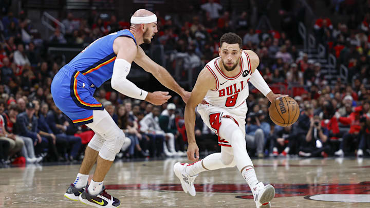 Oklahoma City Thunder guard Alex Caruso (9) defends against Chicago Bulls guard Zach LaVine (8) during the first half at United Center. Mandatory Credit: Kamil Krzaczynski-Imagn Images
