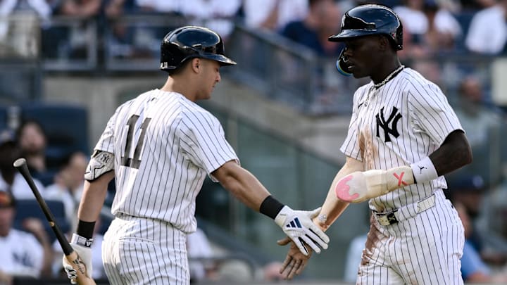 Aug 10, 2024; Bronx, New York, USA; New York Yankees third baseman Jazz Chisholm Jr. (13) is greeted at home plate by New York Yankees shortstop Anthony Volpe (11) after scoring on a RBI single by New York Yankees second baseman Gleyber Torres (not pictured) during the second inning against the Texas Rangers at Yankee Stadium. Aug 10, 2024; Bronx, New York, USA; New York Yankees third baseman Jazz Chisholm Jr. (13) is greeted at home plate by New York Yankees shortstop Anthony Volpe (11) after scoring on a RBI single by New York Yankees second baseman Gleyber Torres (not pictured) during the second inning against the Texas Rangers at Yankee Stadium.