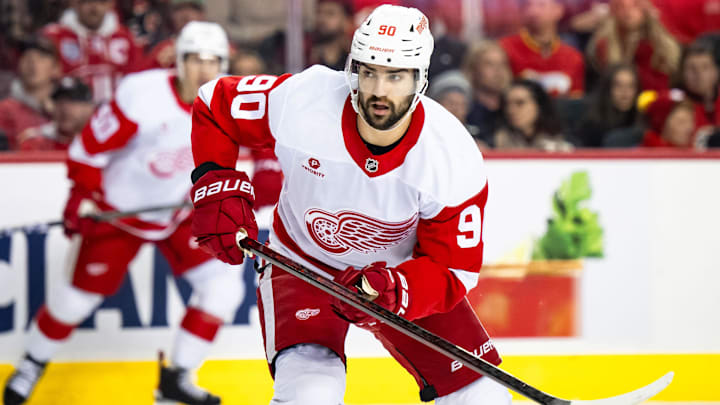 Feb 1, 2025; Calgary, Alberta, CAN; Detroit Red Wings center Joe Veleno (90) in action against the Calgary Flames during the second period at Scotiabank Saddledome. Mandatory Credit: Brett Holmes-Imagn Images