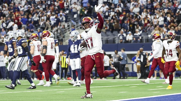 Jan 5, 2025; Arlington, Texas, USA;  Washington Commanders wide receiver Terry McLaurin (17) celebrates after scoring the game-winning touchdown  during the fourth quarter against the Dallas Cowboys at AT&T Stadium. Mandatory Credit: Kevin Jairaj-Imagn Images