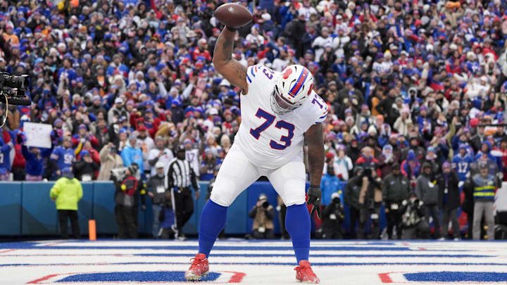 Nov 16, 2025; Orchard Park, New York, USA;  Buffalo Bills offensive tackle Dion Dawkins (73) celebrates Josh Allen’s first quarter touchdown against the Tampa Bay Buccaneers at Highmark Stadium. Mandatory Credit: Gregory Fisher-Imagn Images