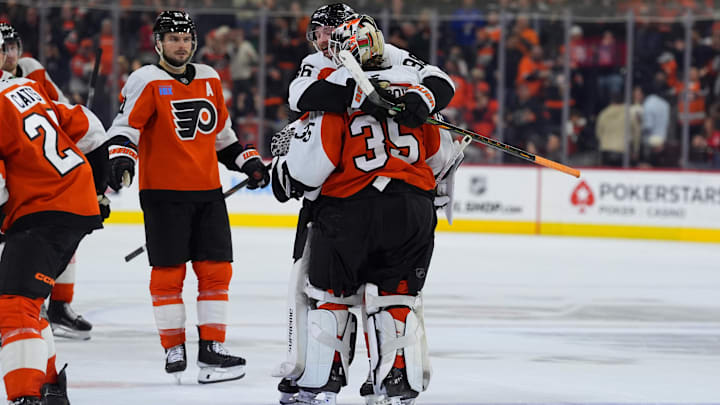 Nov 23, 2024; Philadelphia, Pennsylvania, USA; Philadelphia Flyers left wing Joel Farabee (86) celebrates with goalie Aleksei Kolosov (35) after the game against the Chicago Blackhawks at Wells Fargo Center.