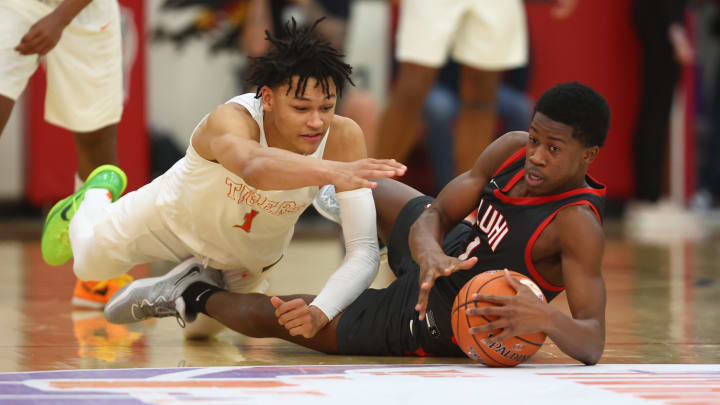 Dec 10, 2022; Scottsdale, AZ, USA; Wasatch Academy guard Isiah Harwell (left) dives for a loose ball against Long Island Lutheran guard VJ Edgecombe during the HoopHall West basketball tournament at Chaparral High School. Mandatory Credit: Mark J. Rebilas-USA TODAY Sports