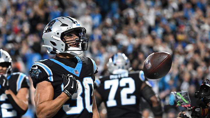 Jan 10, 2026; Charlotte, NC, USA; Carolina Panthers running back Chuba Hubbard (30) reacts after scoring a touchdown in the fourth quarter in an NFC Wild Card Round game at Bank of America Stadium. Mandatory Credit: Bob Donnan-Imagn Images