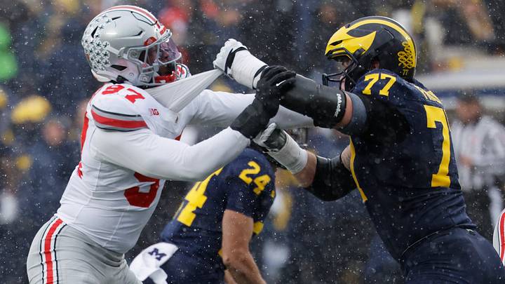 Michigan Wolverines offensive lineman Blake Frazier blocks Ohio State Buckeyes defensive end Kenyatta Jackson Jr. Michigan Wolverines offensive lineman Blake Frazier blocks Ohio State Buckeyes defensive end Kenyatta Jackson Jr.