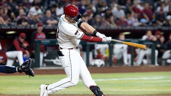 Apr 22, 2025; Phoenix, Arizona, USA; Tampa Bay Rays infielder Tim Tawa hits a solo home run in the fifth inning against the Arizona Diamondbacks at Chase Field. Mandatory Credit: Mark J. Rebilas-Imagn Images Apr 22, 2025; Phoenix, Arizona, USA; Tampa Bay Rays infielder Tim Tawa hits a solo home run in the fifth inning against the Arizona Diamondbacks at Chase Field. Mandatory Credit: Mark J. Rebilas-Imagn Images
