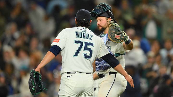 Jun 30, 2026; Seattle, Washington, USA; Seattle Mariners relief pitcher Andres Munoz (75) and catcher Cal Raleigh (29) celebrate after defeating the Los Angeles Angels at T-Mobile Park. Mandatory Credit: Steven Bisig-Imagn Images