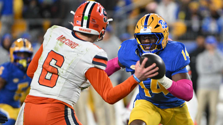 Oct 24, 2024; Pittsburgh, Pennsylvania, USA; Pittsburgh Panthers defensive lineman Chief Borders (14) pressures Syracuse Orange quarterback Kyle McCord (6) during the second quarter  at Acrisure Stadium. Mandatory Credit: Barry Reeger-Imagn Images