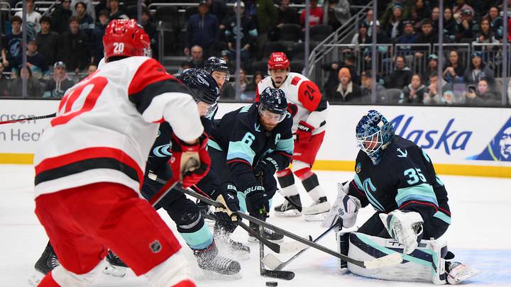 Mar 2, 2026; Seattle, Washington, USA; Seattle Kraken defenseman Adam Larsson (6) and Seattle Kraken goaltender Joey Daccord (35) defend the goal against the Carolina Hurricanes during the third period at Climate Pledge Arena. Mandatory Credit: Steven Bisig-Imagn Images